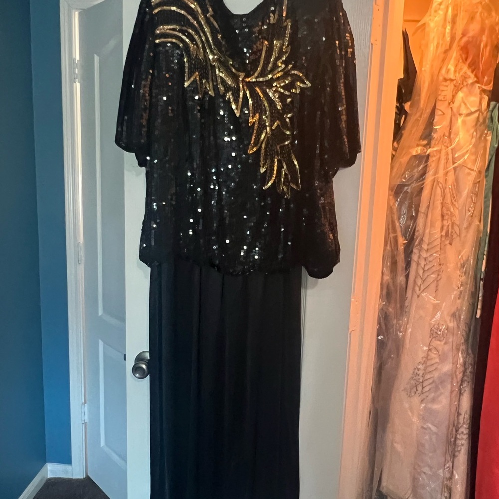 Black and Gold Sequin Top over black dress. Great for parties!
